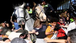 The police charged at the protesters with horses and attacked them with pepper spray.