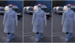 An ambulance worker in PPE kit in Delhi