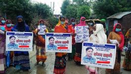 MGNREGA workers with posters of Sanjay Sahni.