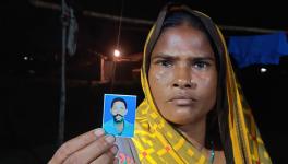 Rekha Devi, showing picture of her dead husband whose life was claimed by illicit liquor on January 1,2020