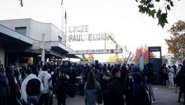 French students gather outside a high school.