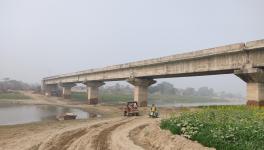 Muddy stretch over partial dried river bed, Khagaria