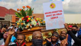 26 February 2021: Thami Molefe’s colleagues carry his coffin through the streets. Molefe was one of three ArcelorMittal employees who died recently at the company’s Vanderbijlpark plant. (Photographs by Magnificent Mndebele)