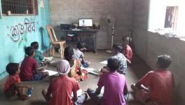 Ghasi Sisa, language teacher is teaching students of Bonda hills through his laptop.  (Photo Courtesy- Ghasi Sisa)