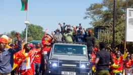 Socialist Party presidential candidate Fred M'membe (center) and other leaders of the party after the filing of nomination papers in Lusaka.