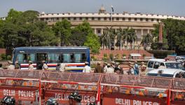 Security personnel deployed near Parliament House ahead of the Opposition leaders' protest march from Parliament House to the Enforcement Directorate (ED) office, in New Delhi, Wednesday, March 15, 2023.