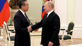 Russian President Vladimir Putin (R) met with Member of the Political Bureau of the Communist Party of China Central Committee Wang Yi, Kremlin, Moscow, February 22, 2023 