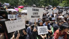 Tribal people of Manipur take part in a ‘Tribal Solidarity protest’ against the ongoing tension in the state, at Jantar Mantar, in New Delhi (PTI Photo/File)