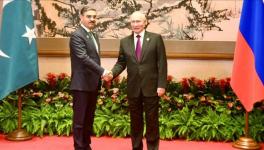 Pakistan’s caretaker Prime Minister Anwaar-ul-Haq Kakar (L) met with  Russian President Vladimir Putin on the sidelines of the 3rd Belt and Road Forum, Beijing, October 18, 2023.