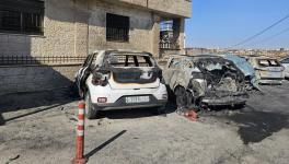 Incinerated cars in Al-Bireh after the settler attack. Photo: Aseel Saleh / Peoples Dispatch