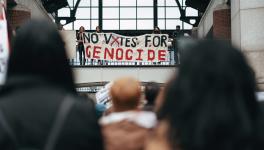 Protesters hang a banner reading "No votes for genocide" ahead of the US presidential elections in Boston, MA. The Israeli genocide in Gaza has become one of the defining issues of the elections. Photo: Micah Fong/PSL