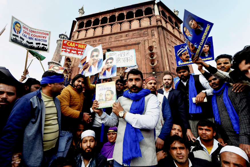 Bhim Army chief Chandrasekhar Azad holds a copy of the 'Indian Constitution' during a protest against Citizenship (Amendment) Act at Jama Masjid in New Delhi on Friday