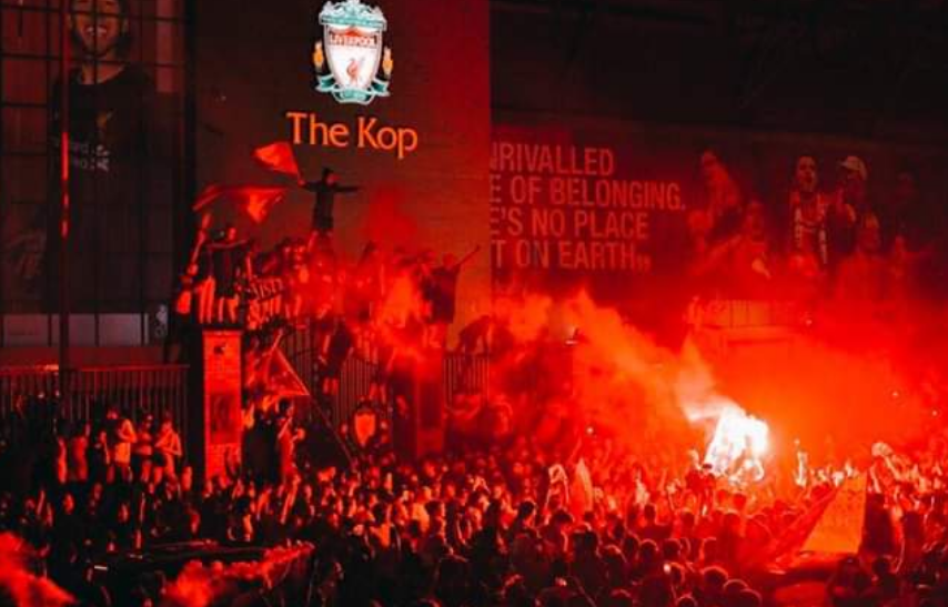 Liverpool fans celebrate the English football club's Premier League title victory at Anfield