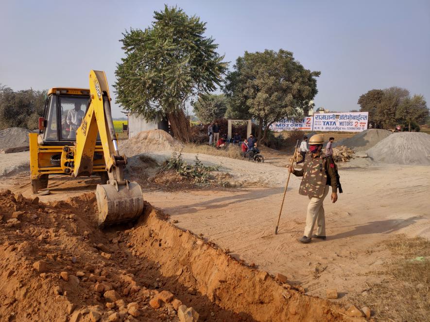 JCB digging up the road