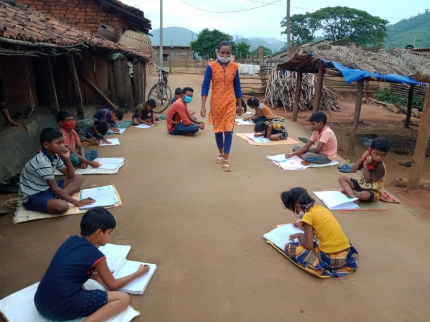 Village Volunteer conducting home-based classes in the village