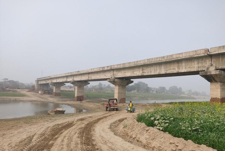 Muddy stretch over partial dried river bed, Khagaria