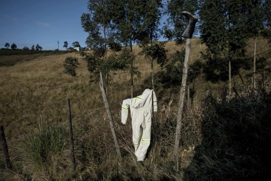 28 June 2013: Phumzile Sokanyile's washed overalls dry in the sun after his death at his home in Mdumazulu in Ngqeleni, Eastern Cape.