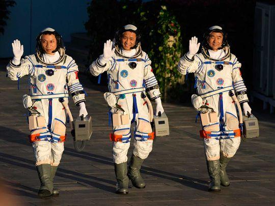 Chinese astronauts, from left, Tang Hongbo, Nie Haisheng, and Liu Boming