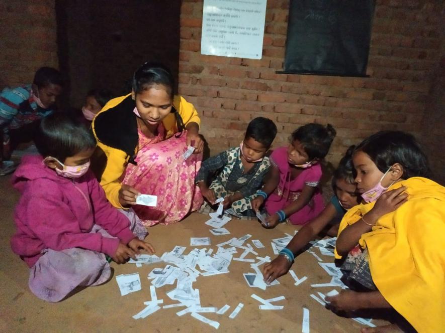 Santoshi and children at night school