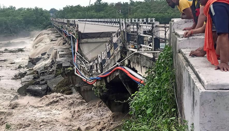 critical Dehradun-Rishikesh bridge on the Jhakan river, that left thousands of commuters scrambling for alternate routes. 