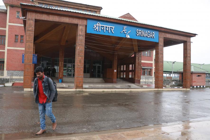 A Non local Labourar standing outside railway station Nowgam, waiting for train. Photo by Kamran Yousuf