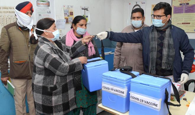 Officials of Jalandhar Civil Hospital hand over the vaccine to the staff of community health centres