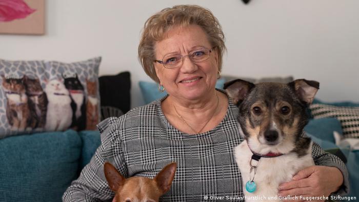 Ilona Barber with her dogs in her Fuggerei apartment