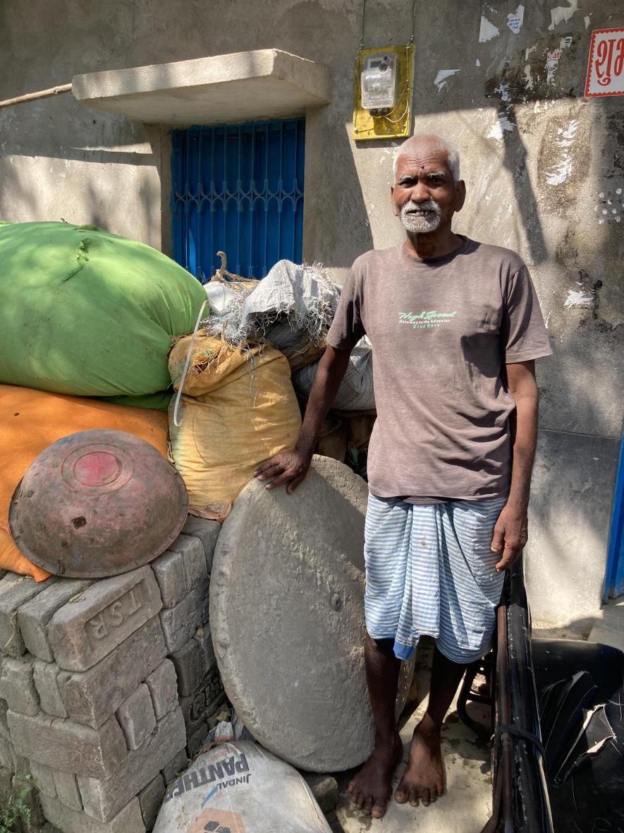 Kamlesh Pandit in Bishnuganj, posing with his chaak