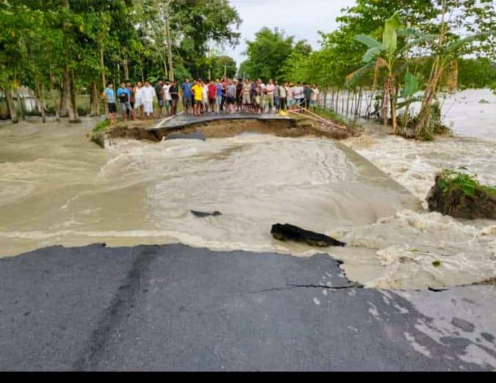 The flood water broke the road and swept it away.