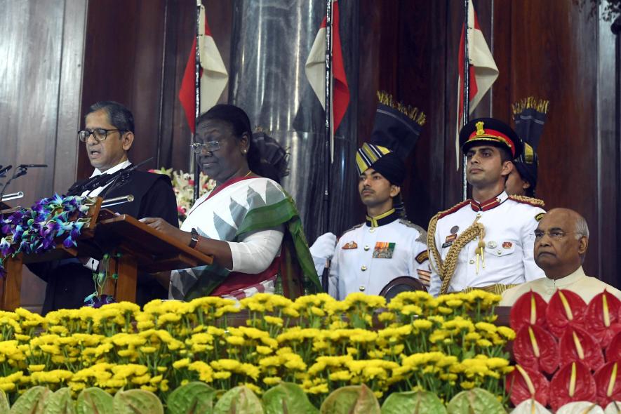 Chief Justice of India (CJI) Justice NV Ramana administers the oath of office to President Droupadi Murmu, as former President Ram Nath Kovind looks on, at the Central Hall of the Parliament,