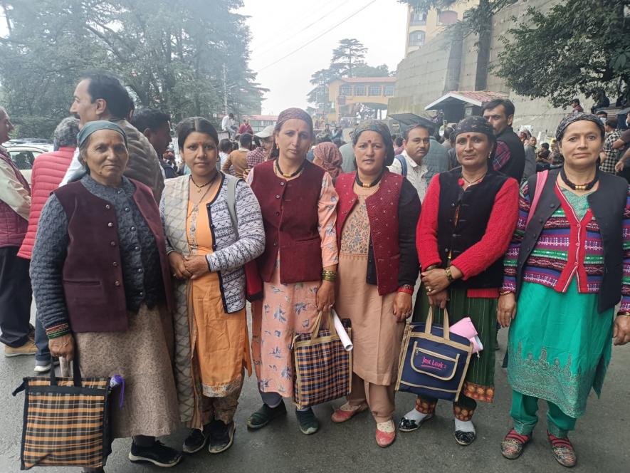 Ruhri Lata (second from left), with other apple growers from her village