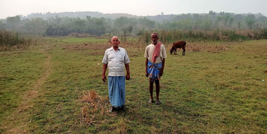 8. santosh Khan and Amrit khan on their land which covered by soil and coal stone.