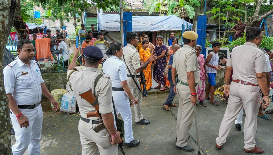 Security people arrive to intervene after tension between two political groups during panchayat elections in North 24 Pargana district of West Bengal, Saturday, July 8, 2023. Security people arrive to intervene after tension between two political groups during panchayat elections in North 24 Pargana district of West Bengal, Saturday, July 8, 2023. 