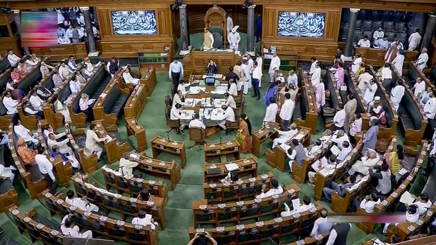 Opposition MPs protest in the Lok Sabha during the Monsoon session of Parliament, in New Delhi, Friday, July 28, 2023.