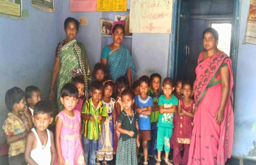 Anganwadi helper Mohammad Mahboobi (left) with worker Sridevi and a child’s mother in Pacharla village, in the Jogulamba Gadwal district of Telangana.